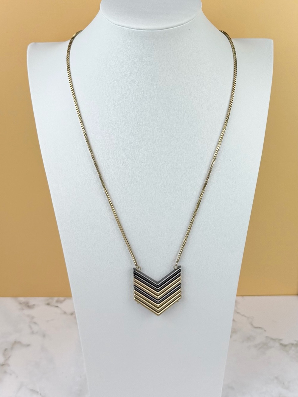 Romolo Two-Tone Geometric Chevron Pendant Necklace – Gold & Gunmetal Grey